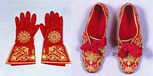 The papal gauntlets on the left side.